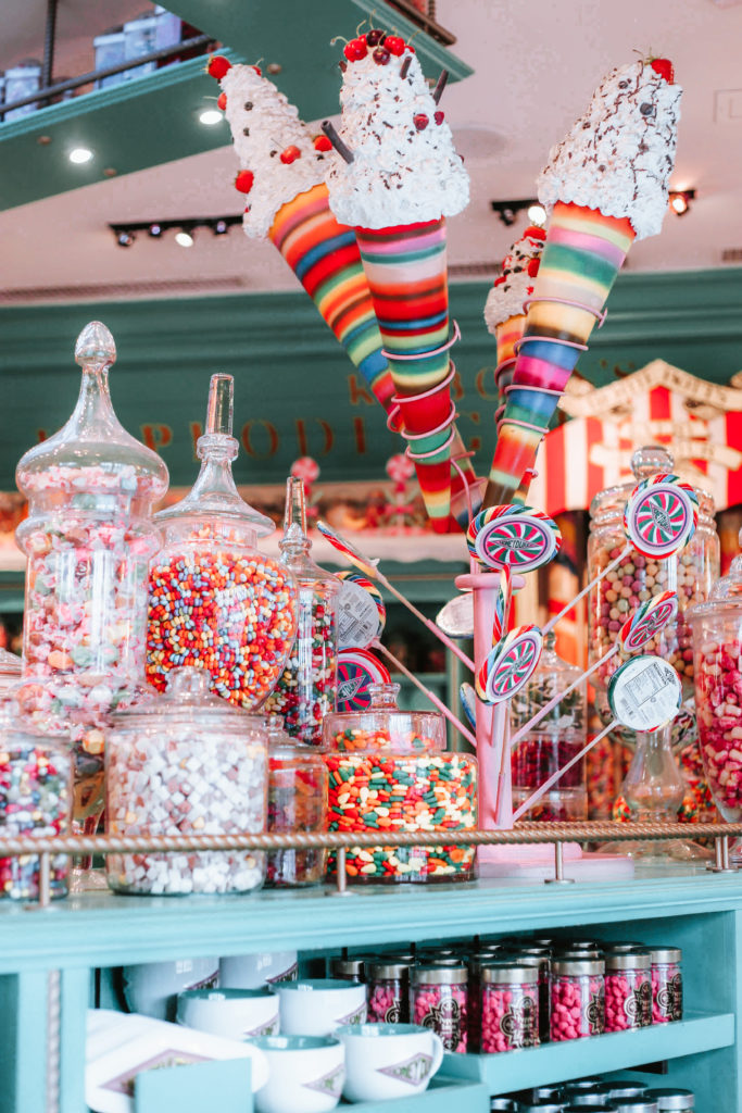 Rainbow-colored lollipops and candy jars at Honeydukes
