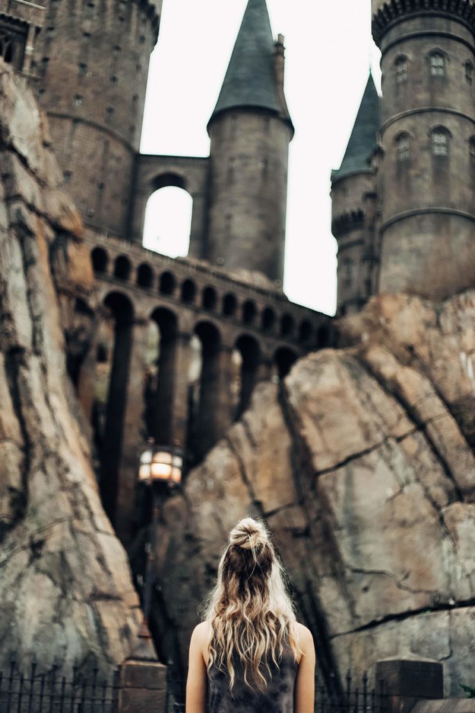 Girl looking up at a bridge at Hogwarts Castle