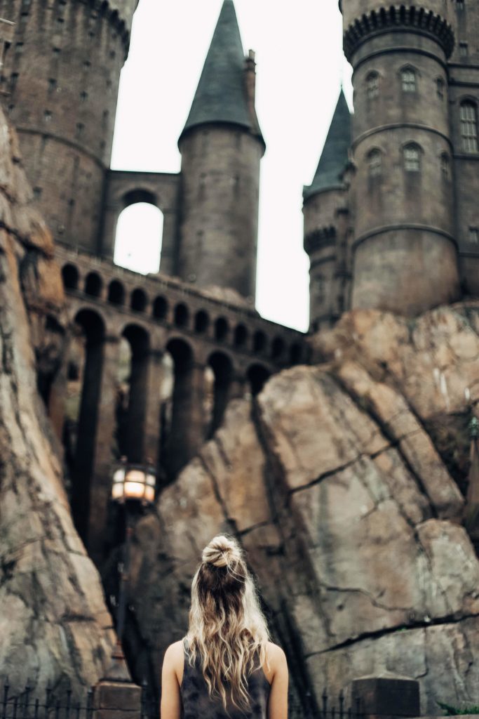 Girl looking up at Hogwarts at the entrance to Harry Potter and the Forbidden Journey