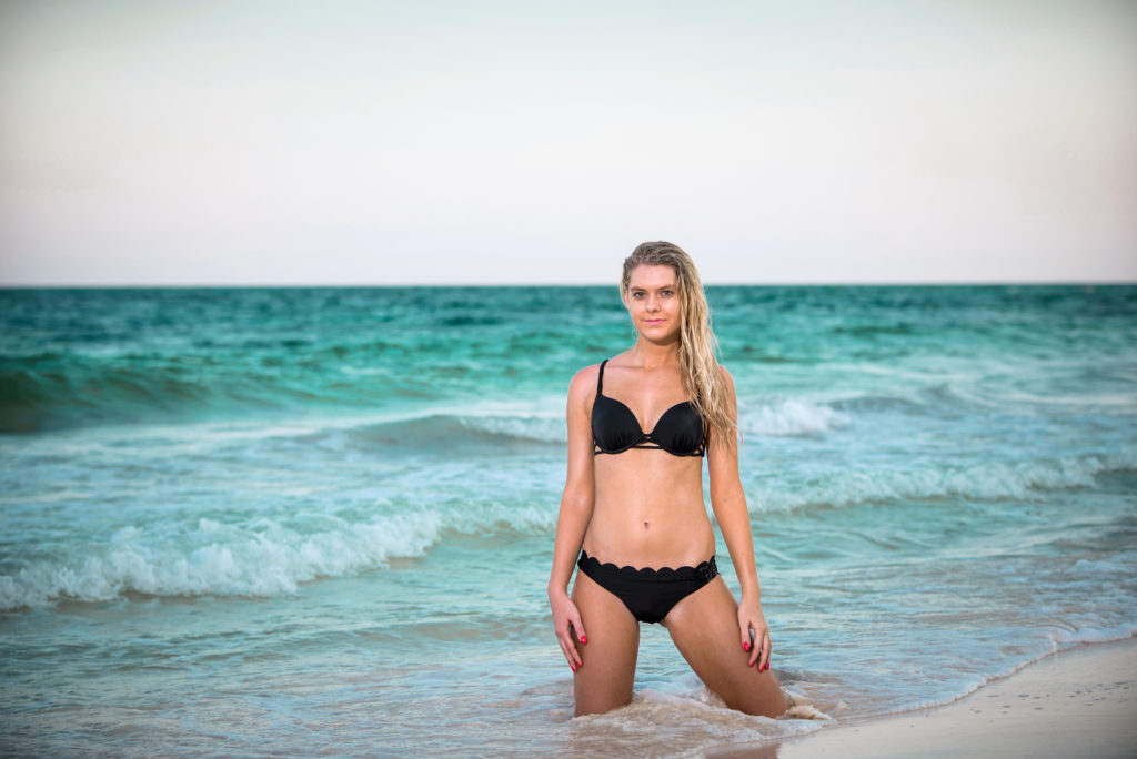 Model strikes a pose during a sexy bikini photoshoot in Tulum, Mexico