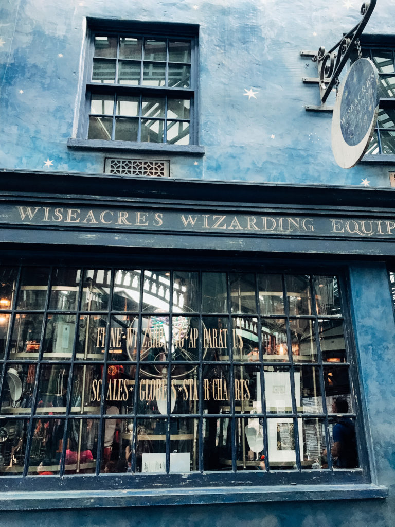 Store window closeup of Wiseacre's Wizarding Equipment