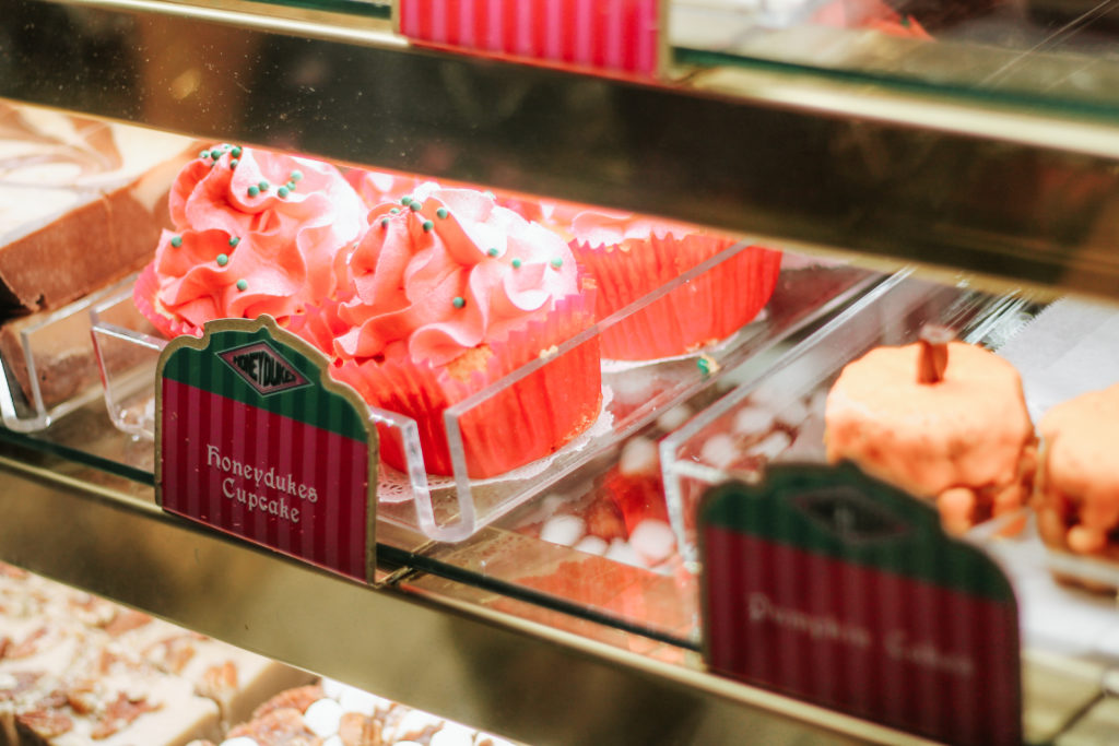 Closeup of pink Honeydukes cupcakes and pastries